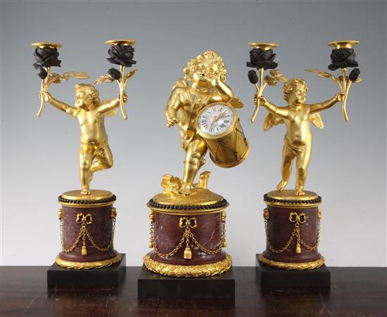 A French ormolu and rouge marble clock garniture, candelabra 13.25in.